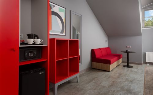 The first category | Standard room with two single beds and a sofa