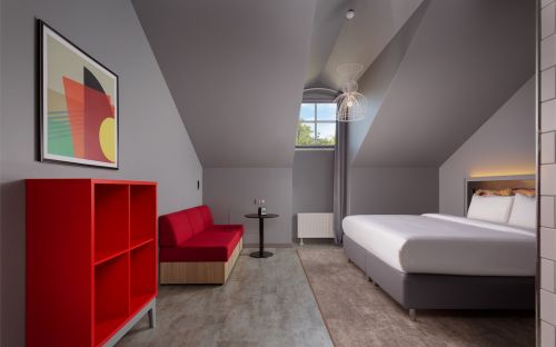The first category | Standard room with a king-size bed and a sofa